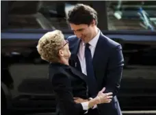  ?? MARK BLINCH/REUTERS ?? A reporter timed Trudeau’s embrace with Kathleen Wynne at five seconds.