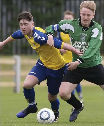  ??  ?? Wicklow Town’s Jack Geraghty and Arklow United’s James Hogan compete for the ball during the Youth Cup semi-final in Ferndale Park, Arklow.