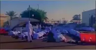  ?? ?? Residents offer funeral prayers for an elderly American woman at a mosque in Abu Dhabi in a screen grab from a video shared by UAE Minister of Interior, Lt-gen Sheikh Saif bin Zayed Al Nahyan. — supplied photo