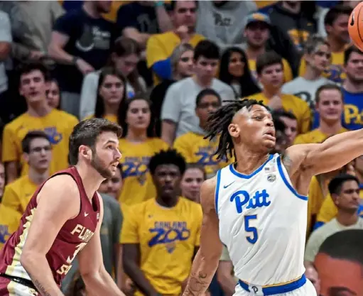  ?? Matt Freed/Post-Gazette ?? Au’Diese Toney reaches for a loose ball against Trent Forrest in the Panthers’ 63-61 win against Florida State Nov. 6 at Petersen Events Center. The Seminoles, who reached the Sweet 16 last season, have won 11 of 12 since that loss and are ranked No. 18.