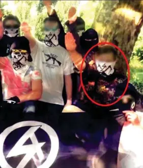  ??  ?? Sickening: The officer, circled, and other recruits give Nazi salutes