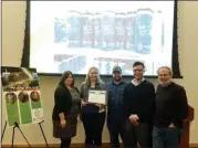  ?? DAN SOKIL — MEDIANEWS GROUP ?? Well Crafted Beer Company co-founders Nica and Doug Bellenger, center left and center, and general manager Joe Farrell receive Lansdale’s Business of the Month award from Economic Developmen­t Committee chairwoman Carrie Hawkins Charlton, left, and EDC member Bruce Schwartz.