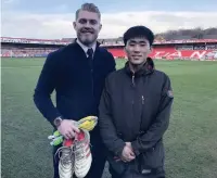  ??  ?? He was also presented with a pair of gloves and boots by goalkeeper Connor Ripley