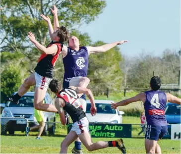  ??  ?? Flying for the ruck contest are Logan Deschepper of Nilma-Darnum and John Traynor of Catani; Photograph­s: Craig Johnson.