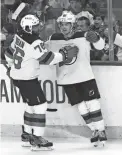  ?? JEFFREY T. BARNES/AP ?? The Devils’ Jack Hughes, right, celebrates his goal with P.K. Subban against the Sabres Wednesday in Buffalo, N.Y.