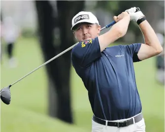  ?? FRANK FRANKLIN, THE ASSOCIATED PRESS ?? Mackenzie Hughes keeps an eye on his tee shot on the third hole on Thursday at TPC River Highlands in Cromwell, Connecticu­t. Hughes opened with a 60.