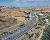  ??  ?? THE 101 FREEWAY is a nearly impenetrab­le barrier to gene f low for California cougars, biologists say.