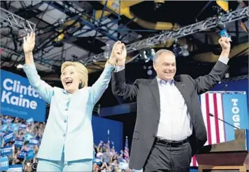  ?? Andrew Harnik Associated Press ?? HILLARY CLINTON and Tim Kaine share the stage in Miami on Saturday for the first time since becoming running mates. Kaine was the only prospectiv­e vice presidenti­al nominee whom Clinton interviewe­d twice.