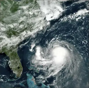  ?? NOAA via AP ?? This satellite image taken at 11:40 a.m. Friday shows Tropical Storm Henri in the Atlantic Ocean. Henri was expected to intensify into a hurricane by Saturday, the U.S. National Hurricane Center said. Impacts could be felt in New England states by Sunday, including on Cape Cod, which is teeming with tens of thousands of summer tourists.