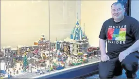  ?? ?? Lee Stanley with his snowy town centre Lego creation at Parkway Shopping