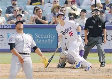  ?? Mark J. Terrill Associated Press ?? WILL SMITH watches his game-winning solo home run off Rockies reliever Carlos Estevez. Smith’s heroics came after the Dodgers’ top pitching prospect, Josiah Gray, went four innings in his first major league start.