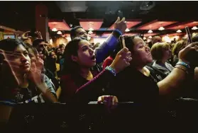  ?? Godofredo A. Vasquez / Staff photograph­er ?? Stephanie Mendoza, left, and Madeline Garza, center, cheer for Beto O’Rourke.