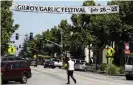  ?? Photograph: Mario Tama/Getty Images ?? A sign advertisin­g the Gilroy Garlic Festival, a popular event in California.