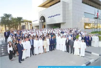  ??  ?? KUWAIT: NBK’s Executive Management pose with a group of new recruits.