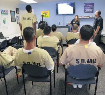  ?? Photograph­s by Nelvin C. Cepeda San Diego Union-Tribune ?? SAN DIEGO COUNTY jail inmates at the East Mesa Reentry Facility Job Center in class with Second Chance, an organizati­on that helps people transition back to life outside of prison.