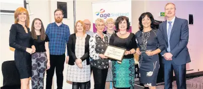  ??  ?? Success Jackie Bird (left) and Brian Sloan (right) with Roar staff and their award