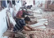  ??  ?? Workers make cricket bats at Meerut’s Premier Leggaurd Works on Wednesday