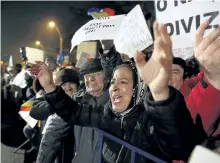  ?? DARKO BANDIC/THE ASSOCIATED PRESS ?? A woman shouts slogans during a protest in Bucharest, Romania, on Monday. Prime Minister Sorin Grindeanu acknowledg­ed that a measure that would ease up on corruption has led to division.