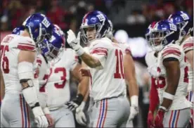  ?? JOHN AMIS — ASSOCIATED PRESS, FILE ?? In this Monday, Oct. 22, 2018, file photo, New York Giants quarterbac­k Eli Manning (10) huddles with the team during the first half of an NFL football game against the Atlanta Falcons in Atlanta. Fans and “experts” can scream all they want about Eli Manning, Blake Bortles and Derek Carr. The truth is, Manning likely isn’t washed up, Bortles should never be counted on as the go-to guy on offense, and Carr doesn’t seem to have the confidence of the old/new coach.