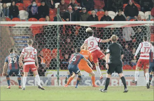  ?? PICTURE: BRUCE ROLLINSON ?? FIRST BLOW: John Marquis heads home to break the deadlock for Doncaster Rovers against Bradford City last night. He added a second to earn a 2-0 win.