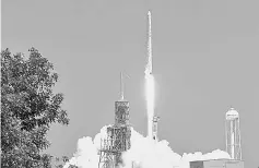  ??  ?? Photo shows SpaceX launching its 12th resupply mission to the Internatio­nal Space Station from Nasa’s Kennedy Space Centre in Florida. — AFP photo