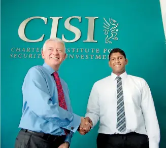  ??  ?? Mr. Simon Culhane, Chartered FCSI - Chief Executive Officer of CISI UK Congratula­tes Majid Ikram Thowfeek, from the British School of Kuwait (BSK) and a student of First Global Academy, for becoming the first in the world to have the Islamic Finance...