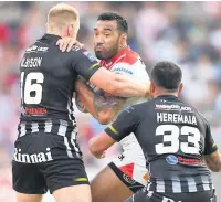  ?? Dave Howarth ?? Saints’ Dominique Peyroux is tackled by Widnes Vikings’ Tom Olbison ( and Aaron Heremaia.