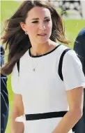  ?? LEFTERIS PITARAKIS/ AP PHOTO ?? When Kate Middleton, Duchess of Cambridge, wore a white- and- navy Jaeger dress earlier this month, it sold out almost instantly.