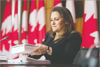  ?? ADRIAN WYLD/THE CANADIAN PRESS ?? Finance Minister Chrystia Freeland, seen at a news conference in April, is weighing pitches for Toronto or Montreal to host the Internatio­nal Sustainabi­lity Standards Board headquarte­rs.