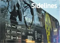  ??  ?? A window of Dortmund’s team bus is damaged Tuesday after an explosion before the Champions League quarterfin­al soccer match between Borussia Dortmund and Monaco in Dortmund, Germany.