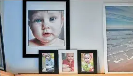  ?? Getty Images ?? Liven a wall with family portraits of all colors and sizes.