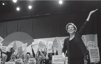  ?? Rachel Woolf, Special to The Denver Post ?? Sen. Elizabeth Warren waves to the crowd at the Fillmore Auditorium in Denver on Sunday afternoon in front of over-capacity crowd of about 4,000.