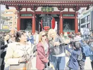  ?? ?? Tourists from overseas visit Tokyo’s Asakusa area in March 2016. — Japan News-Yomiuri photo