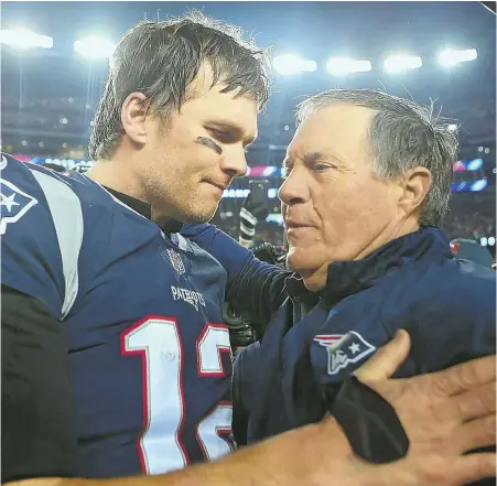  ?? STAFF FILE PHOTO BY NANCY LANE ?? TIME TO COME TOGETHER: Tom Brady hugs Bill Belichick following the AFC Championsh­ip Game victory in January at Gillette Stadium, but reported tension between the Patriots quarterbac­k and coach has prevailed since.