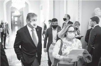  ?? AL DRAGO/THE NEW YORK TIMES ?? Democratic Sens. Joe Manchin of West Virginia, left, and Kyrsten Sinema of Ariziona are seen on Capitol Hill earlier this month. Both are attracting campaign contributi­ons from business interests and conservati­ve donors.