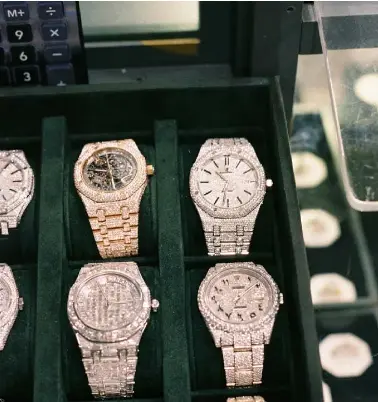  ??  ?? Below: some ‘iced-out’ watches for sale at Trotters can feature up to 3,500 individual diamonds in ‘honeycomb’ sets