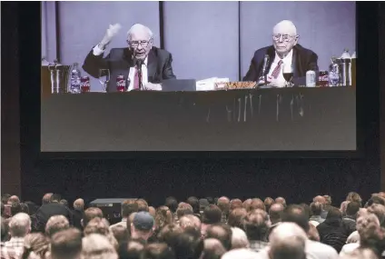  ?? AP FOTO ?? LEARNING FROM THE BEST. An estimated 40,000 people are thought to have gone to Omaha, Nebraska for the Berkshire Hathaway annual shareholde­rs’ meeting, where chairman Warren Buffet (left) and vice chairman Charlie Munger spend hours answering questions.