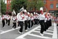  ??  ?? A marching band playing in the Fourth of July parade on Broadway in Saratoga Springs.