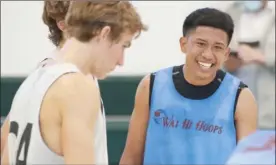  ??  ?? Wai Hi Hoops’ Holden Ioanis smiles during his team’s game against Pueo Athletic Club. Pueo won 57-51 in overtime.