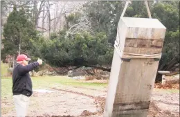  ?? Ken Borsuk / Hearst Connecticu­t Media ?? Six historic monoliths, each one weighing 10,000 pounds, were delivered to Cos Cob on Friday morning. They were placed at the Montgomery Pinetum property and will be surrounded with new landscapin­g in time for spring.