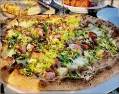  ??  ?? Susie Davidson Powell / For the Times Union A pizza at Nonne Pizza & Cucina has prosciutto and shaved Brussels sprouts.