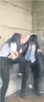  ??  ?? Footage from the video that was circulated among Morgan Academy students showing a girl attacking a male pupil.