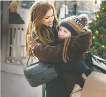  ??  ?? Isla Fisher, left, and Willa Skye are fun to watch in Godmothere­d.