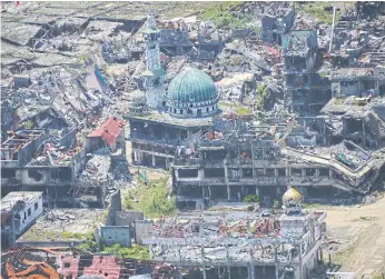  ??  ?? NOTHING SPARED: A destroyed mosque in Marawi City after five months of house-to-house fighting between troops and jihadists loyal to Islamic State.