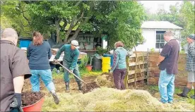  ?? PHOTO: SUPPLIED. ?? CHB Permacultu­re Group members mucking in at a composting session.