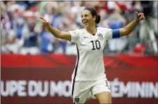  ?? ASSOCIATED PRESS FILE ?? South Jersey’s Carli Lloyd, here celebratin­g a third goal against Japan during the first half of the FIFA Women’s World Cup soccer championsh­ip in 2015, has written a memoir that among other things reveals her estranged relationsh­ip with her parents.