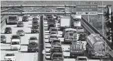  ?? NICK PROCAYLO • POSTMEDIA FILE ?? Backed-up traffic on the Second Narrows Bridge in Vancouver in 2013.