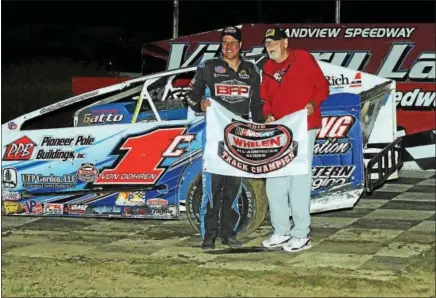  ?? SUBMITTED PHOTO - RICK KEPNER ?? Nine-time Modified champion Craig Von Dohren, left, holds the track champion banner alongside track owner Bruce Rogers after capturing the season title on Sept. 3 at Grandview Speedway.