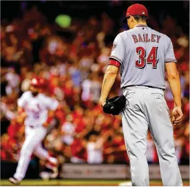  ?? DILIP VISHWANAT / GETTY IMAGES ?? Reds pitcher Homer Bailey reacts after giving up a two-run home run Friday in St. Louis. The Reds are 1-18 in Bailey’s 19 starts this season.