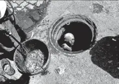  ?? ARIJIT SEN/HT ?? A sewer worker cleans a manhole in Mumbai, June 17, 2016